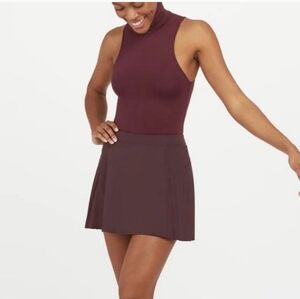 NWT Spanx Get Moving Pleated Skirt Skort Size Small. Color: Dark fig